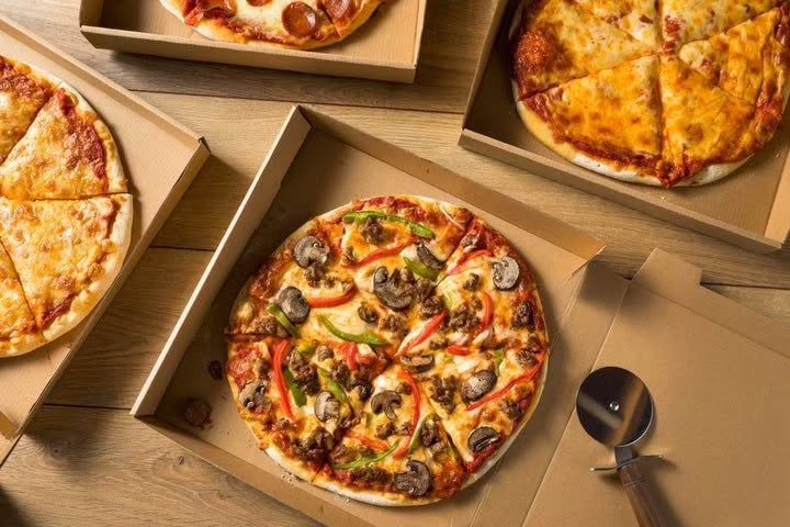 Hot freshly baked pizza loaded with cheese and chicken toppings